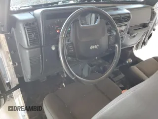 2006 Jeep Wrangler Rubicon with VIN 1J4FA69S26P734731, listed as a Copart auction lot 52009295 with 117,872 mi miles and Salvage title. Bid and sale history available at DreamBid. Image 8.