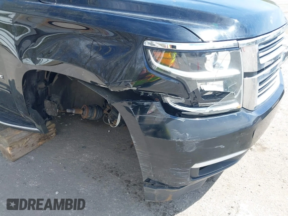 2015 Chevrolet Tahoe LTZ with VIN 1GNSKCKC8FR514671, listed as a IAAI auction lot 42157084 with 182,665 mi miles and . Bid and sale history available at DreamBid. Image 6.