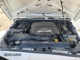 2014 Jeep Wrangler Unlimited Sahara with VIN 1C4BJWEG1EL210949, listed as a Copart auction lot 60977555 with 122,495 mi miles and Salvage title. Bid and sale history available at DreamBid. Image 12.