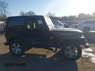 2006 Jeep Wrangler Sport with VIN 1J4FA49SX6P733671, listed as a IAAI auction lot 41779611 with 189,701 mi miles and . Bid and sale history available at carsss.com. Image 13.