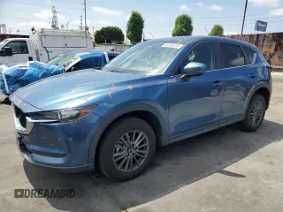 2021 Mazda CX-5 Touring z VIN JM3KFBCM6M1400461, wystawiony jako Copart lot #60104235 z przebiegiem 30 220 mil mil oraz Szkoda całkowita • Salvage title. Historia ofert i sprzedaży dostępna na DreamBid. Obrazek 1.