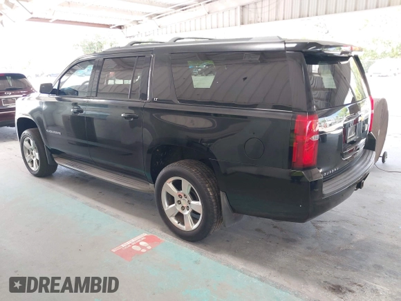 2015 Chevrolet Suburban LT with VIN 1GNSKJKC7FR199544, listed as a IAAI auction lot 42169017 with 219,219 mi miles and . Bid and sale history available at DreamBid. Image 3.