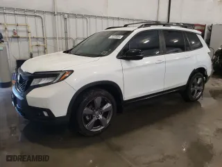 2020 Honda Passport Touring with VIN 5FNYF8H9XLB008647, listed as a Copart auction lot 73320804 with 70,068 mi miles and Salvage Title. Bid and sale history available at carsss.com. Image 1.