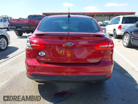 2015 Ford Focus Titanium with VIN 1FADP3J29FL230664, listed as a IAAI auction lot 41870083 with 125,578 mi miles and . Bid and sale history available at DreamBid. Image 16.