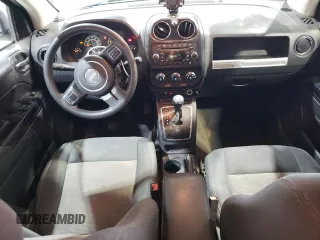 2016 Jeep Compass Sport with VIN 1C4NJCBA1GD512864, listed as a Copart auction lot 56297115 with 216,693 mi miles and Salvage title. Bid and sale history available at DreamBid. Image 8.