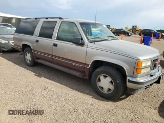 1998 GMC Suburban with VIN 1GKFK16RXWJ721305, listed as a Copart auction lot 64112165 with 197,756 mi miles and Clean title. Bid and sale history available at DreamBid. Image 4.