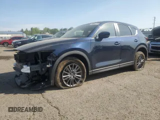 2021 Mazda CX-5 Touring z VIN JM3KFBCM5M0410663, wystawiony jako Copart lot #54943785 z przebiegiem 14 949 mil mil oraz Szkody całkowita. Historia ofert i sprzedaży dostępna na DreamBid. Obrazek 1.