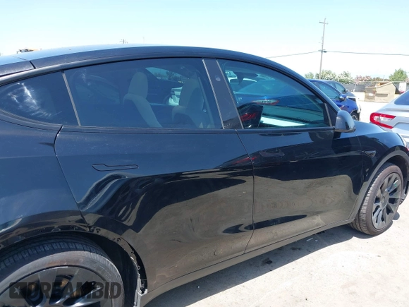 2024 Tesla Model Y with VIN 7SAYGDED9RF191453, listed as a IAAI auction lot 42272051 with 7,805 mi miles and . Bid and sale history available at DreamBid. Image 14.