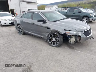 2014 Ford Taurus SHO with VIN 1FAHP2KTXEG160800, listed as a IAAI auction lot 42083237 with 75,048 mi miles. Bid and sale history available at carsss.com. Image 1.