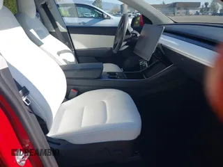 2020 Tesla Model Y Long Range with VIN 5YJYGDEE8LF057014, listed as a IAAI auction lot 41988113 with 18,246 mi miles and . Bid and sale history available at DreamBid. Image 5.