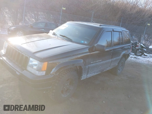 1996 Jeep Grand Cherokee Laredo with VIN 1J4GZ58S3TC197587, listed as a IAAI auction lot 41423318 with 200,116 mi miles. Bid and sale history available at carsss.com. Image 2.