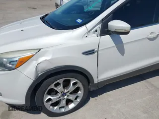 2013 Ford Escape Titanium with VIN 1FMCU0J9XDUA33872, listed as a IAAI auction lot 42009286 with 161,677 mi miles. Bid and sale history available at carsss.com. Image 6.