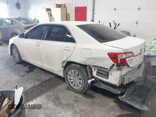 2014 Toyota Camry L with VIN 4T1BF1FK4EU763009, listed as a IAAI auction lot 41615134 with 165,293 mi miles and . Bid and sale history available at carsss.com. Image 3.