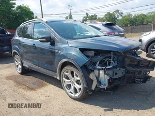 2019 Ford Escape Titanium with VIN 1FMCU9J99KUC00935, listed as a IAAI auction lot 42583250 with 91,241 mi miles and . Bid and sale history available at DreamBid. Image 1.