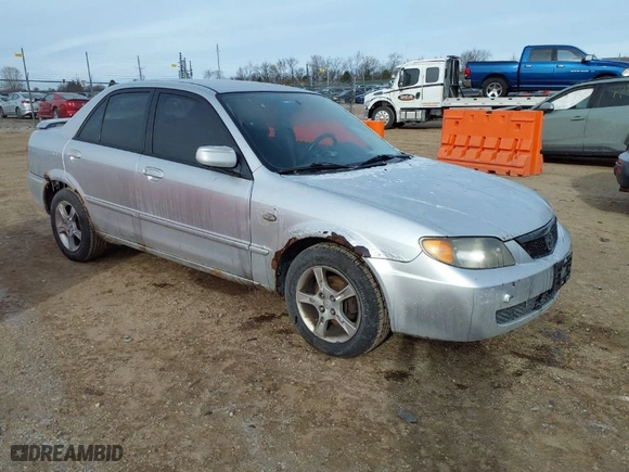 2003 Mazda Protege DX with VIN JM1BJ225830202261, listed as a IAAI auction lot 41273338 with 163,003 mi miles. Bid and sale history available at carsss.com. Image 1.