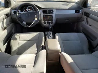 2004 Suzuki Forenza S z VIN KL5JD52Z14K950658, wystawiony jako Copart lot #74824154 z przebiegiem 99 150 mil mil oraz Tytuł czysty. Historia ofert i sprzedaży dostępna na DreamBid. Obrazek 8.