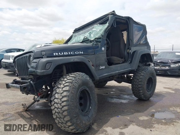 2004 Jeep Wrangler Rubicon z VIN 1J4FA69S84P727716, wystawiony jako IAAI lot #42162129 z przebiegiem 90 844 mil mil oraz . Historia ofert i sprzedaży dostępna na DreamBid. Obrazek 2.