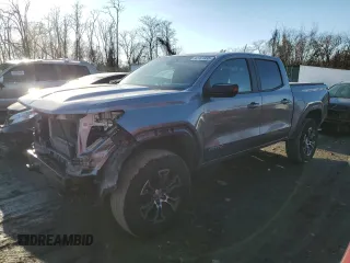 2023 GMC Canyon 4WD AT4 with VIN 1GTP6DEK5P1170230, listed as a Copart auction lot 42701935 with 26,704 mi miles and Salvage Title. Bid and sale history available at carsss.com. Image 1.