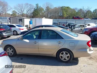 2002 Toyota Camry LE z VIN 4T1BE32K02U051709, wystawiony jako IAAI lot #41485620 z przebiegiem 232 876 mil mil oraz . Historia ofert i sprzedaży dostępna na DreamBid. Obrazek 14.