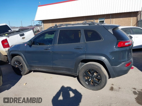 2017 Jeep Cherokee Trailhawk L Plus with VIN 1C4PJMBBXHW634944, listed as a IAAI auction lot 41022673 with 116,542 mi miles. Bid and sale history available at carsss.com. Image 15.
