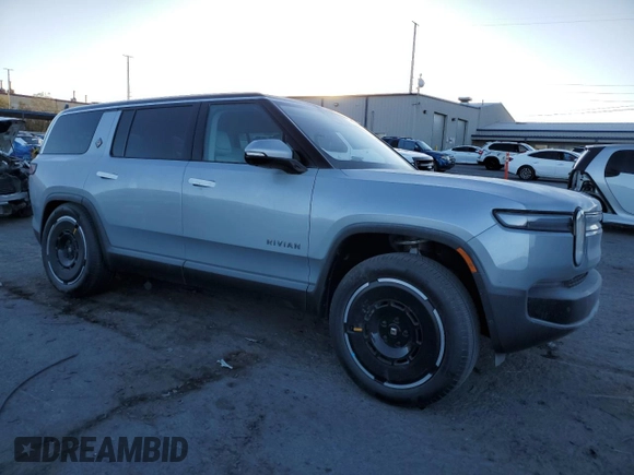 2025 Rivian R1S Adventure with VIN 7PDSGBBA0SN051096, listed as a Copart auction lot 87441054 with 30 mi miles and Salvage Title. Bid and sale history available at carsss.com. Image 4.