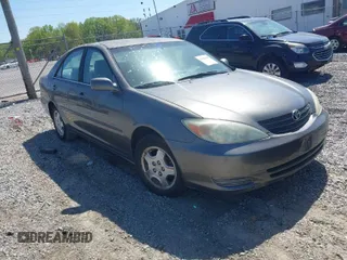 2002 Toyota Camry XLE z VIN 4T1BF32K32U536293, wystawiony jako IAAI lot #41983949 z przebiegiem 241 547 mil mil oraz . Historia ofert i sprzedaży dostępna na DreamBid. Obrazek 1.