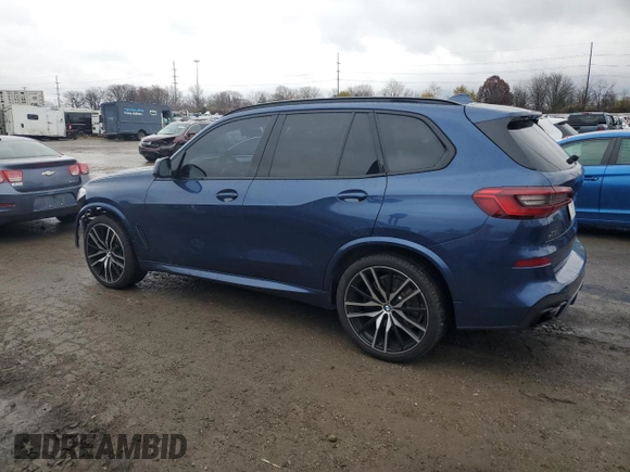 2020 BMW X5 M50i with VIN 5UXJU4C07LLE46002, listed as a Copart auction lot 77853984 with 74,098 mi miles and Salvage Title. Bid and sale history available at DreamBid. Image 2.