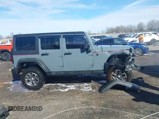 2015 Jeep Wrangler Unlimited Willys Wheeler with VIN 1C4BJWDG4FL589822, listed as a IAAI auction lot 41732614 with 149,112 mi miles and . Bid and sale history available at DreamBid. Image 14.