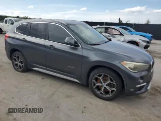 2017 BMW X1 xDrive28i with VIN WBXHT3C32H5F75870, listed as a Copart auction lot 64420385 with 158,640 mi miles and Clean title. Bid and sale history available at DreamBid. Image 4.