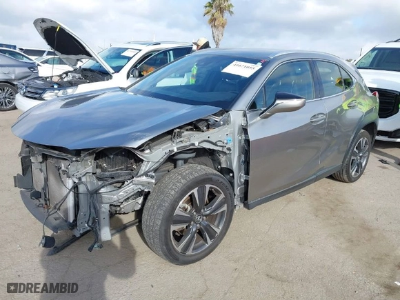 2021 Lexus UX with VIN JTHX3JBH4M2043263, listed as a IAAI auction lot 41671055 with 100,589 mi miles. Bid and sale history available at carsss.com. Image 2.