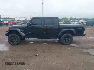 2023 Jeep Gladiator Overland with VIN 1C6JJTFM9PL593659, listed as a IAAI auction lot 42470253 with 34,374 mi miles and . Bid and sale history available at DreamBid. Image 14.