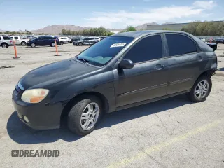 2004 Kia Spectra LX z VIN KNAFE122045009092, wystawiony jako Copart lot #58809455 z przebiegiem 124 248 mil mil oraz Szkoda całkowita • Salvage title. Historia ofert i sprzedaży dostępna na DreamBid. Obrazek 1.