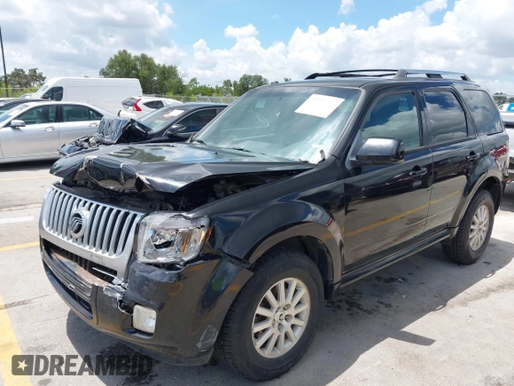 2011 Mercury Mariner Premier with VIN 4M2CN8HGXBKJ07489, listed as a IAAI auction lot 42574942 with 163,786 mi miles and . Bid and sale history available at DreamBid. Image 2.