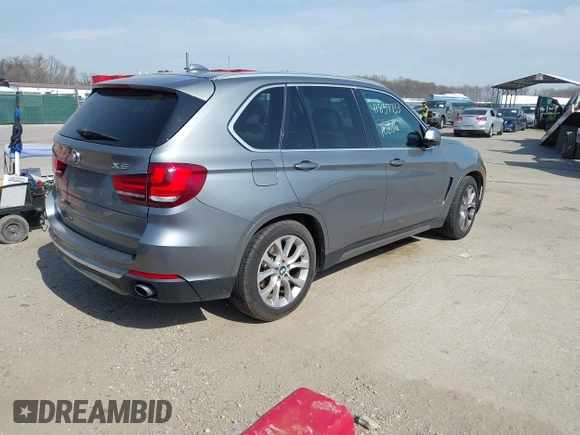 2015 BMW X5 xDrive35i with VIN 5UXKR0C53F0K60910, listed as a IAAI auction lot 41857733 with 153,583 mi miles. Bid and sale history available at carsss.com. Image 4.