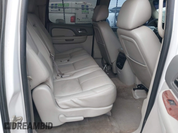 2013 Chevrolet Suburban LT with VIN 1GNSCJE05DR147101, listed as a IAAI auction lot 42336950 with 147,429 mi miles and . Bid and sale history available at DreamBid. Image 8.