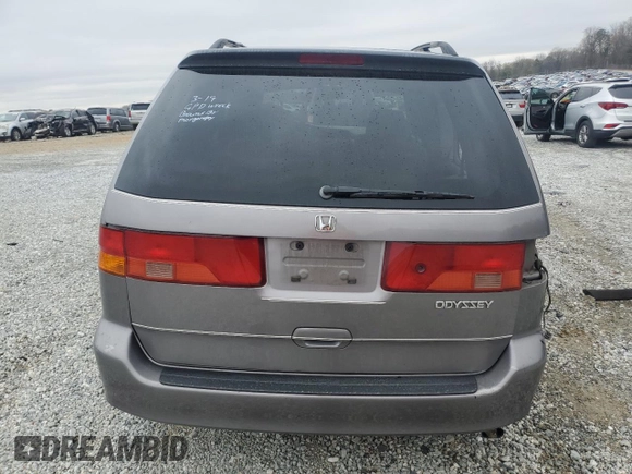 2000 Honda Odyssey EX with VIN 2HKRL1865YH513885, listed as a Copart auction lot 50223505 with 214,627 mi miles and Salvage Title. Bid and sale history available at DreamBid. Image 6.