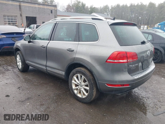 2013 Volkswagen Touareg Lux with VIN WVGEF9BP7DD007170, listed as a IAAI auction lot 41787075 with 131,089 mi miles and . Bid and sale history available at DreamBid. Image 3.