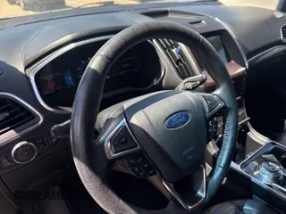 2020 Ford Edge Titanium z VIN 2FMPK3K95LBA30633, wystawiony jako IAAI lot #42377179 z przebiegiem 104 190 mil mil oraz . Historia ofert i sprzedaży dostępna na DreamBid. Obrazek 1.