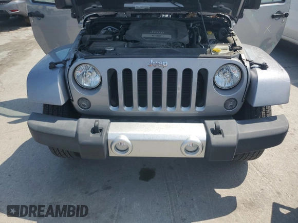 2015 Jeep Wrangler Sahara with VIN 1C4AJWBG1FL705900, listed as a Copart auction lot 62353275 with 64,866 mi miles and Salvage title. Bid and sale history available at DreamBid. Image 11.