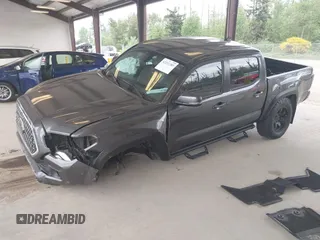 2019 Toyota Tacoma SR z VIN 3TMCZ5AN1KM257081, wystawiony jako IAAI lot #42211385 z przebiegiem 60 229 mil mil oraz . Historia ofert i sprzedaży dostępna na DreamBid. Obrazek 2.
