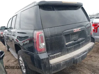 2016 GMC Yukon SLE with VIN 1GKS2AKC2GR357481, listed as a IAAI auction lot 41715909 with 165,377 mi miles. Bid and sale history available at carsss.com. Image 3.