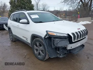 2016 Jeep Cherokee Latitude with VIN 1C4PJMCB7GW268714, listed as a IAAI auction lot 41655450 with 180,603 mi miles. Bid and sale history available at carsss.com. Image 1.