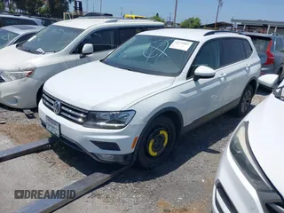 2018 Volkswagen Tiguan S with VIN 3VV1B7AX8JM032990, listed as a IAAI auction lot 42279807 with 74,185 mi miles and . Bid and sale history available at DreamBid. Image 2.