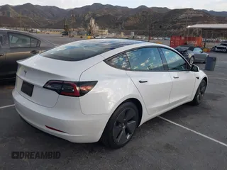 2022 Tesla Model 3 with VIN 5YJ3E1EA9NF375335, listed as a IAAI auction lot 41676024 with 18,836 mi miles. Bid and sale history available at carsss.com. Image 4.