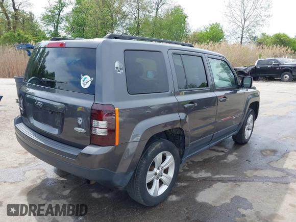2014 Jeep Patriot Latitude with VIN 1C4NJRFB3ED847997, listed as a IAAI auction lot 42109140 with 121,299 mi miles and . Bid and sale history available at carsss.com. Image 4.