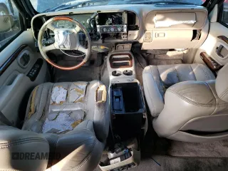 1999 Cadillac Escalade z VIN 1GYEK13R7XR405790, wystawiony jako Copart lot #84478384 z przebiegiem 244 195 mil mil oraz Szkody całkowita. Historia ofert i sprzedaży dostępna na DreamBid. Obrazek 8.