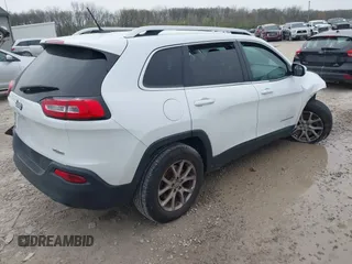 2014 Jeep Cherokee Latitude with VIN 1C4PJMCSXEW150735, listed as a IAAI auction lot 42020944 with 76,303 mi miles and . Bid and sale history available at carsss.com. Image 4.