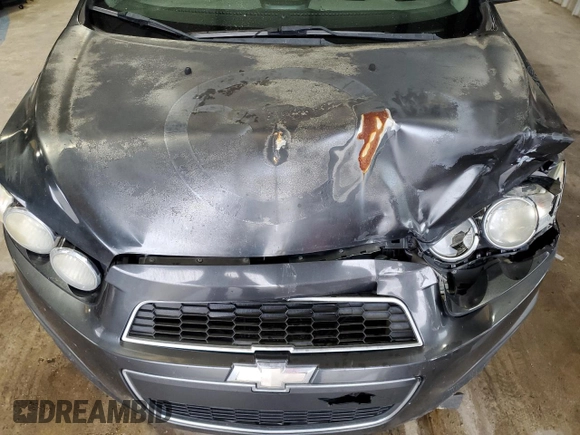 2014 Chevrolet Sonic LT z VIN 1G1JC5SH1E4118997, wystawiony jako Copart lot #70792334 z przebiegiem 166 691 mil mil oraz Szkoda całkowita • Salvage title. Historia ofert i sprzedaży dostępna na DreamBid. Obrazek 11.