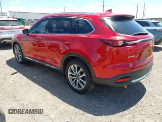 2017 Mazda CX-9 Grand Touring z VIN JM3TCADY3H0140895, wystawiony jako IAAI lot #42817948 z przebiegiem 125 288 mil mil oraz . Historia ofert i sprzedaży dostępna na DreamBid. Obrazek 3.