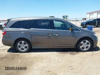 2012 Honda Odyssey Touring with VIN 5FNRL5H93CB109394, listed as a IAAI auction lot 42280018 with 190,412 mi miles and . Bid and sale history available at DreamBid. Image 13.